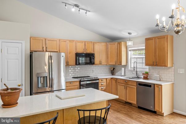 Chandelier, Interior, Kitchen, Pendant Lights, Stainless Steel Appliances, Wood Texture Flooring