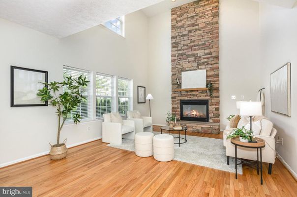 Fireplace, Interior, Living room, Recessed Lighting, Stone Walls, Wood Texture Flooring