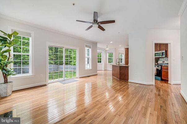 Empty room, Interior, Kitchen, Pendant Lights, Recessed Lighting, Stainless Steel Appliances, Wood Texture Flooring