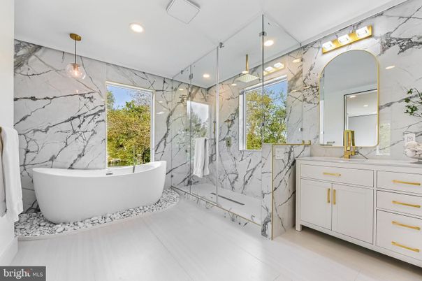 Bathroom, Dual Sink Vanities, Free Standing Baths, Glass Shower, Interior, Marble Walls, Pendant Lights, Recessed Lighting