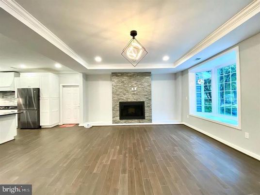Fireplace, Interior, Kitchen, Pendant Lights, Recessed Lighting, Stainless Steel Appliances, Stone Walls, Wood Texture Flooring