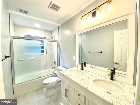 Bathroom, Dual Sink Vanities, Glass Shower, Interior, Marble, Marble Walls, Recessed Lighting