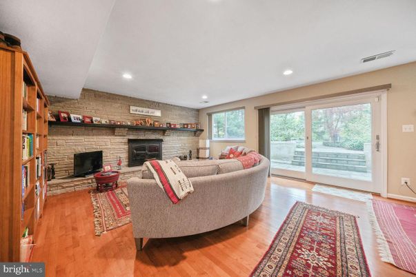 Fireplace, Interior, Living room, Recessed Lighting, Stone Walls, Wood Texture Flooring