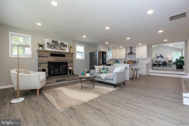 Fireplace, Interior, Kitchen, Living room, Recessed Lighting, Stainless Steel Appliances, Wood Texture Flooring