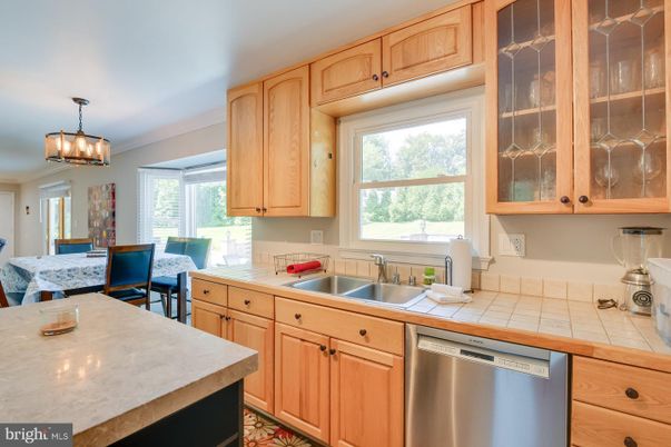 Dining room, Interior, Kitchen, Pendant Lights, Stainless Steel Appliances, Tile Countertops