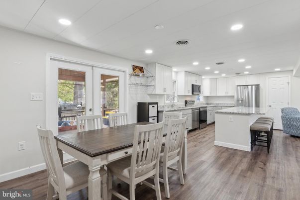 Dining room, Interior, Kitchen, Recessed Lighting, Stainless Steel Appliances, Wood Texture Flooring