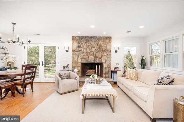 Chandelier, Dining room, Fireplace, Interior, Living room, Recessed Lighting, Stone Walls, Wood Texture Flooring