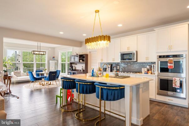 Chandelier, Dining room, Interior, Kitchen, Pendant Lights, Recessed Lighting, Stainless Steel Appliances, Wood Texture Flooring