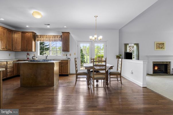Chandelier, Dining room, Fireplace, Interior, Kitchen, Recessed Lighting, Wood Texture Flooring