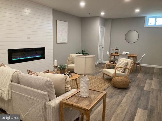 Dining room, Fireplace, Interior, Living room, Recessed Lighting, Wood Texture Flooring