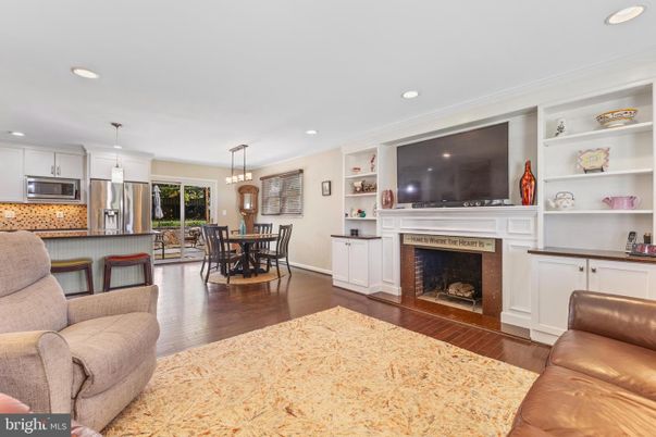 Dining room, Fireplace, Interior, Kitchen, Pendant Lights, Recessed Lighting, Stainless Steel Appliances, Wood Texture Flooring