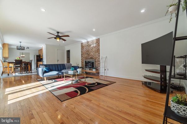 Dining room, Fireplace, Interior, Living room, Recessed Lighting, Stone Walls, Wood Texture Flooring