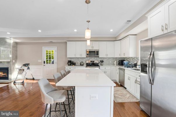 Fireplace, Interior, Kitchen, Pendant Lights, Recessed Lighting, Stainless Steel Appliances, Wood Texture Flooring