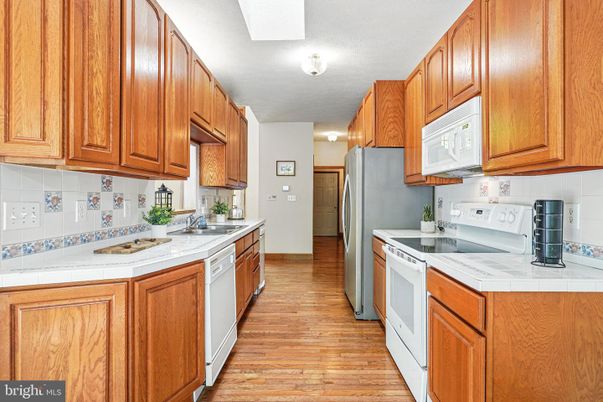 Interior, Kitchen, Tile Countertops, Wood Texture Flooring