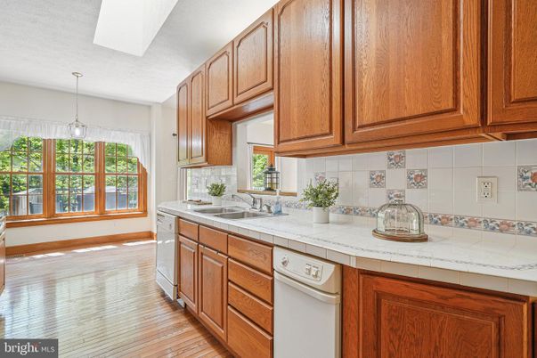 Interior, Kitchen, Pendant Lights, Tile Countertops, Wood Texture Flooring
