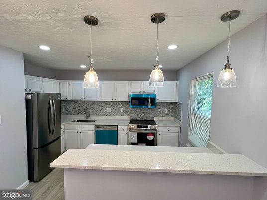 Interior, Kitchen, Pendant Lights, Recessed Lighting, Stainless Steel Appliances, Wood Texture Flooring
