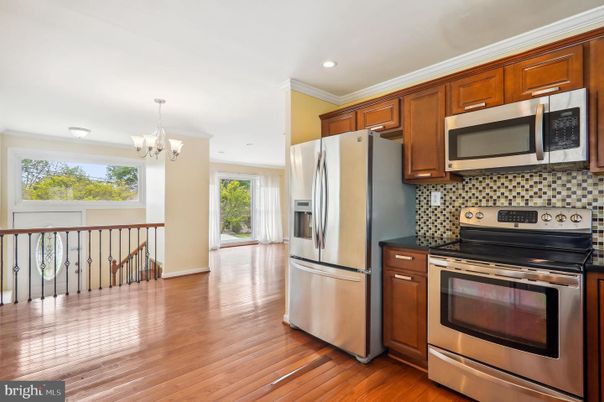 Chandelier, Interior, Kitchen, Recessed Lighting, Stainless Steel Appliances, Wood Texture Flooring