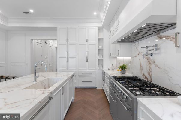 Interior, Kitchen, Marble Walls, Recessed Lighting, Stainless Steel Appliances, Wood Texture Flooring