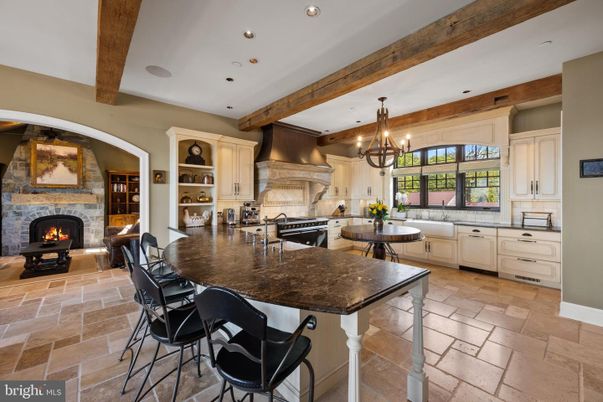 Chandelier, Dining room, Fireplace, Interior, Kitchen, Recessed Lighting, Stainless Steel Appliances, Wooden Beams