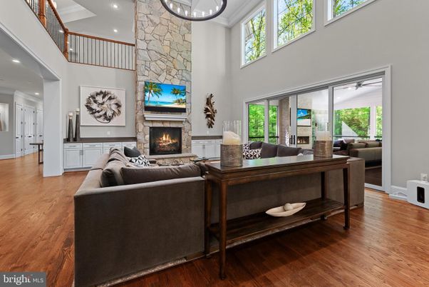 Fireplace, Interior, Living room, Recessed Lighting, Stone Walls, Wood Texture Flooring