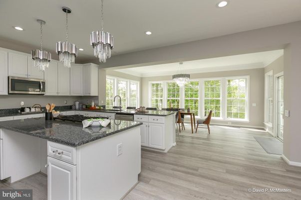 Chandelier, Dining room, Interior, Kitchen, Pendant Lights, Recessed Lighting, Stainless Steel Appliances, Wood Texture Flooring