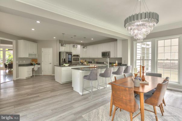 Chandelier, Dining room, Interior, Kitchen, Pendant Lights, Recessed Lighting, Stainless Steel Appliances, Wood Texture Flooring