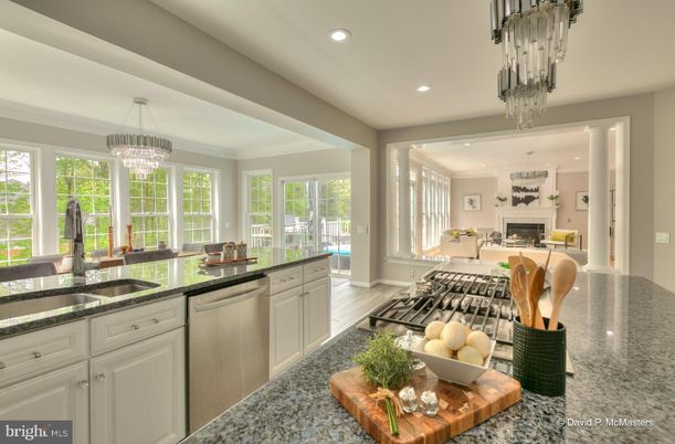 Chandelier, Dining room, Fireplace, Interior, Kitchen, Living room, Pendant Lights, Recessed Lighting, Stainless Steel Appliances, Wood Texture Flooring