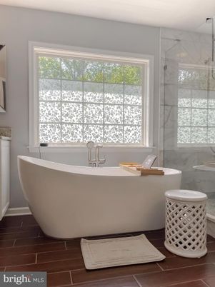 Bathroom, Free Standing Baths, Glass Shower, Interior, Marble Walls, Wood Texture Flooring