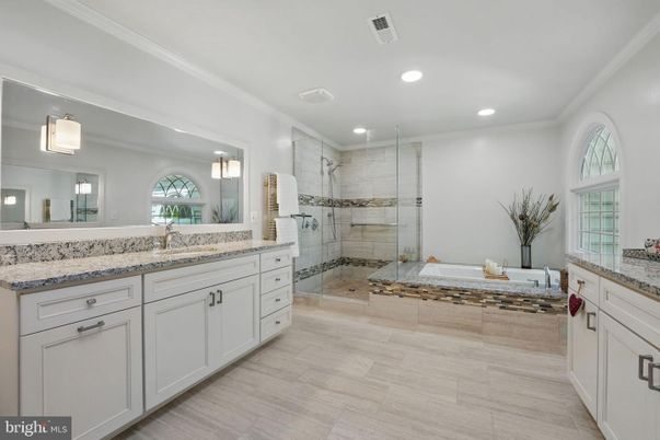 Bathroom, Dual Sink Vanities, Glass Shower, Interior, Recessed Lighting, Wood Texture Flooring