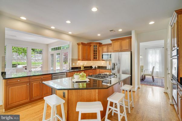 Dining room, Interior, Kitchen, Recessed Lighting, Stainless Steel Appliances, Wood Texture Flooring
