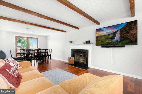 Dining room, Fireplace, Interior, Living room, Recessed Lighting, Wooden Beams, Wood Texture Flooring