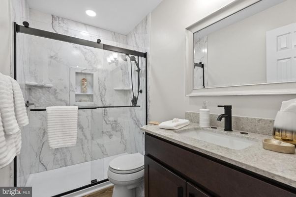 Bathroom, Glass Shower, Interior, Marble Walls, Recessed Lighting, Wood Texture Flooring