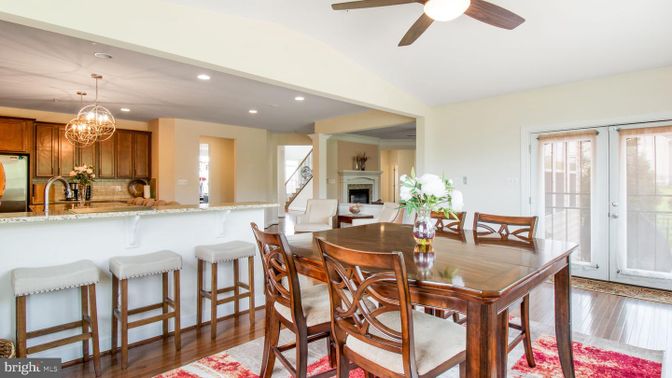 Chandelier, Dining room, Fireplace, Interior, Kitchen, Recessed Lighting, Stainless Steel Appliances, Wood Texture Flooring