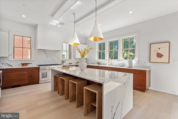 Interior, Kitchen, Marble Walls, Pendant Lights, Recessed Lighting, Stainless Steel Appliances, Wood Texture Flooring