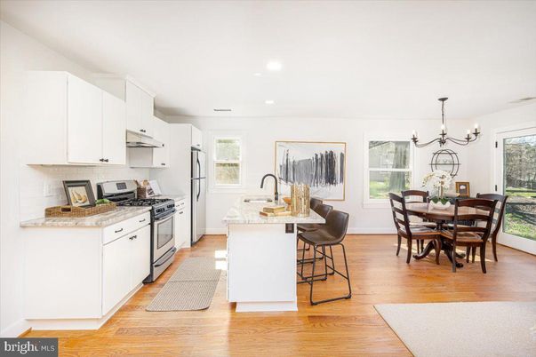 Chandelier, Dining room, Interior, Kitchen, Recessed Lighting, Stainless Steel Appliances, Wood Texture Flooring