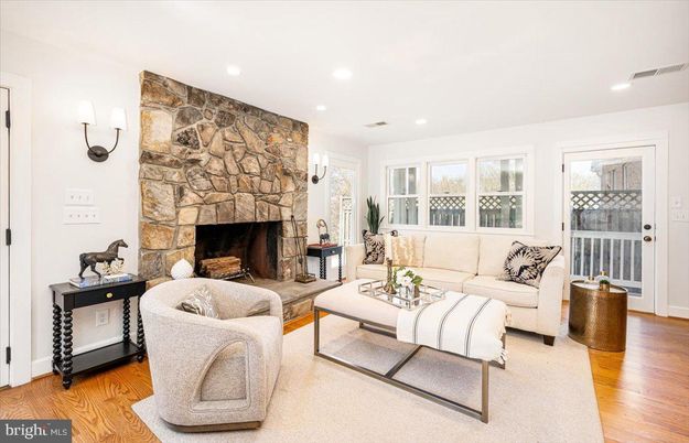 Fireplace, Interior, Living room, Recessed Lighting, Stone Walls, Wood Texture Flooring