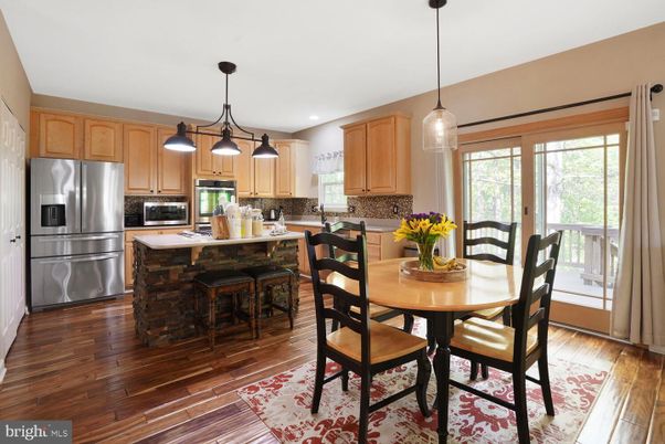 Dining room, Interior, Kitchen, Pendant Lights, Recessed Lighting, Stainless Steel Appliances, Wood Texture Flooring