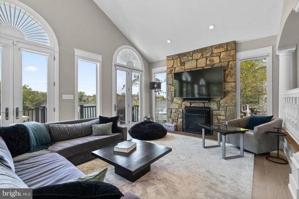 Fireplace, Interior, Living room, Recessed Lighting, Stone Walls, Wood Texture Flooring