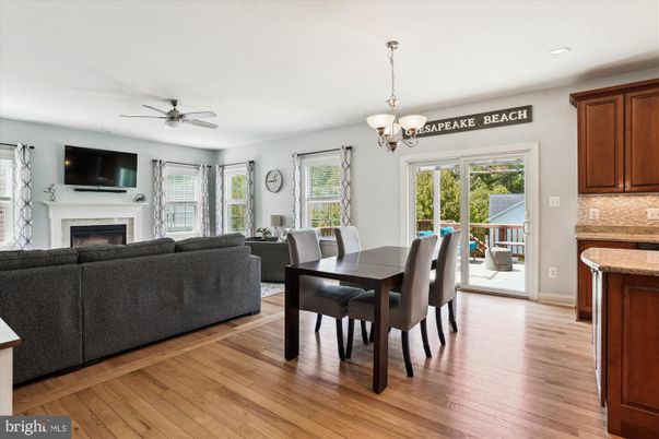Chandelier, Dining room, Fireplace, Interior, Living room, Recessed Lighting, Wood Texture Flooring