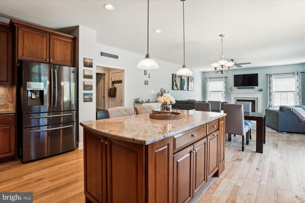 Dining room, Fireplace, Interior, Kitchen, Living room, Pendant Lights, Recessed Lighting, Stainless Steel Appliances, Wood Texture Flooring