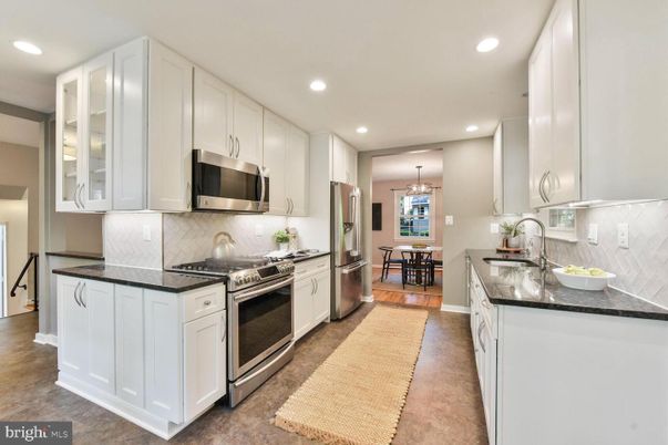 Chandelier, Dining room, Interior, Kitchen, Pendant Lights, Recessed Lighting, Stainless Steel Appliances, Wood Texture Flooring