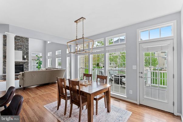 Dining room, Fireplace, Interior, Living room, Pendant Lights, Stone Walls, Wood Texture Flooring