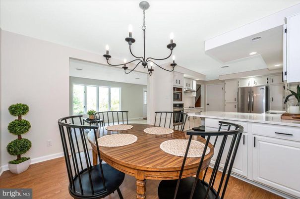 Chandelier, Dining room, Interior, Kitchen, Recessed Lighting, Stainless Steel Appliances, Wood Texture Flooring