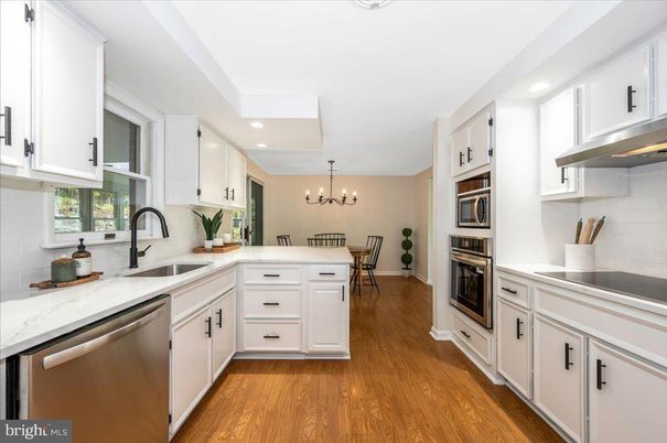 Chandelier, Dining room, Interior, Kitchen, Recessed Lighting, Stainless Steel Appliances, Wood Texture Flooring