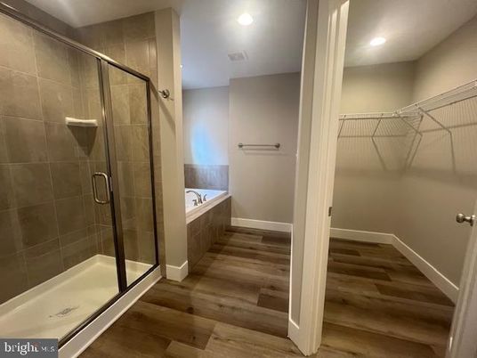 Bathroom, Glass Shower, Interior, Recessed Lighting, Walk-in Closets, Wood Texture Flooring