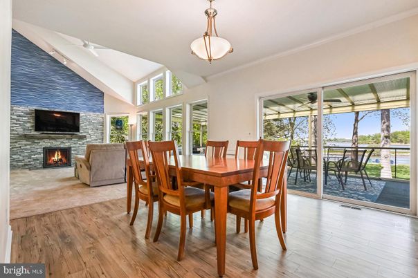 Dining room, Fireplace, Interior, Pendant Lights, Stone Walls, Wood Texture Flooring