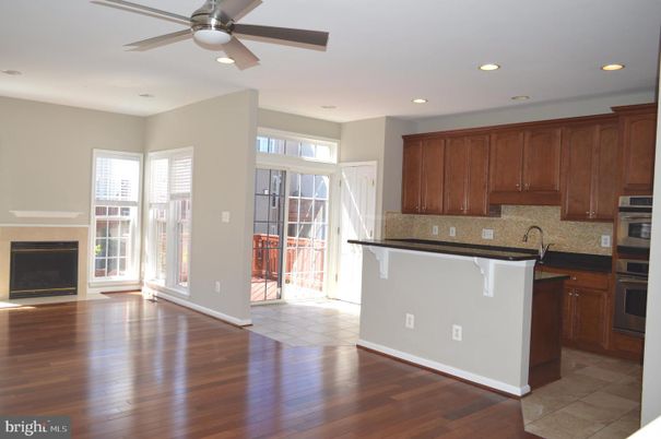 Empty room, Fireplace, Interior, Kitchen, Recessed Lighting, Wood Texture Flooring