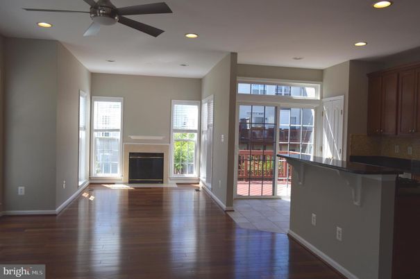 Empty room, Fireplace, Interior, Kitchen, Recessed Lighting, Wood Texture Flooring