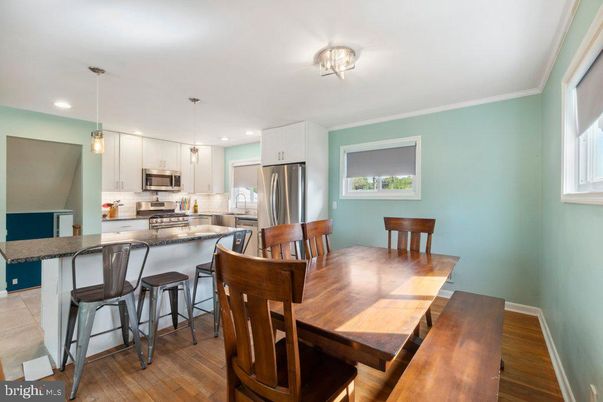 Dining room, Interior, Kitchen, Pendant Lights, Recessed Lighting, Stainless Steel Appliances, Wood Texture Flooring