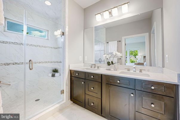 Bathroom, Dual Sink Vanities, Glass Shower, Interior, Marble, Marble Walls, Recessed Lighting
